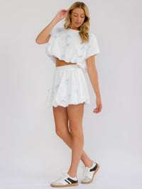 WOMEN'S ELASTIC WAIST BOWS LACE DETAILED BUBBLE HEM MINI SKIRT