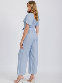 WOMEN'S SHORT SLEEVE SMOCKED FRONT POCKET BELTED CHAMBRAY JUMPSUIT