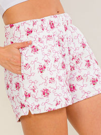 WOMEN'S ELASTIC WAIST FRONT POCKETS FLORAL BOWS PRINT MINI SHORTS
