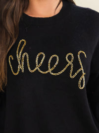 WOMEN'S LONG SLEEVE CHEERS PRINT PULLOVER SWEATER