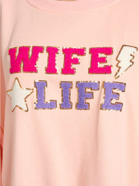 WOMEN'S LONG SLEEVE GRAPHIC HIGH-LOW OVERSIZED TOP