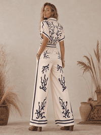 WOMEN'S SHORT SLEEVE BUTTON UP ELASTIC WAIST POCKETS WIDE LEG MULTI PRINT JUMPSUIT