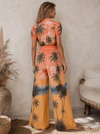 WOMEN'S SHORT SLEEVE BUTTON UP SELF TIE ELASTIC WAIST WIDE LEG MULTI PRINT JUMPSUIT