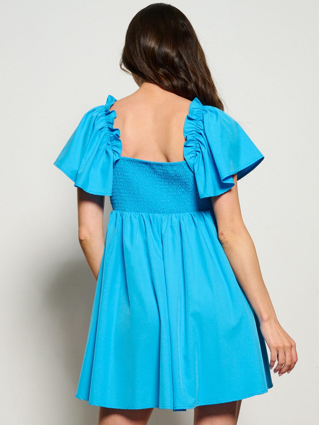 WOMEN'S SHORT RUFFLE SLEEVE V-NECK FIT & FLARE MINI DRESS Wholesalefashiontrends.com WOMEN'S SHORT RUFFLE SLEEVE V-NECK FIT & FLARE MINI DRESS Wholesalefashiontrends.com