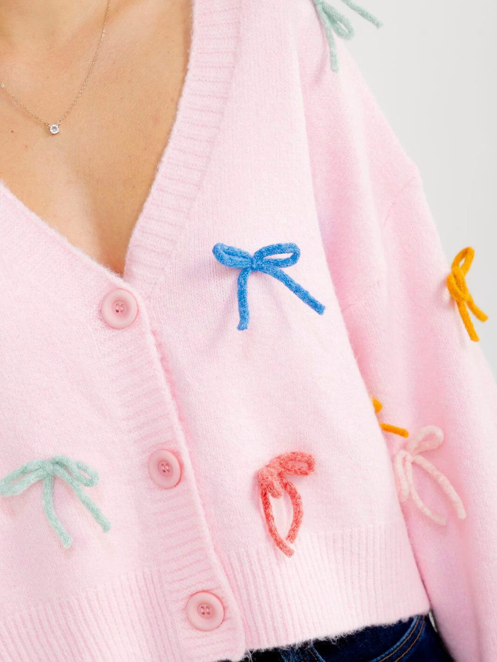 WOMEN'S LONG SLEEVE BUTTON UP BOWS DETAILED FUZZY SWEATER