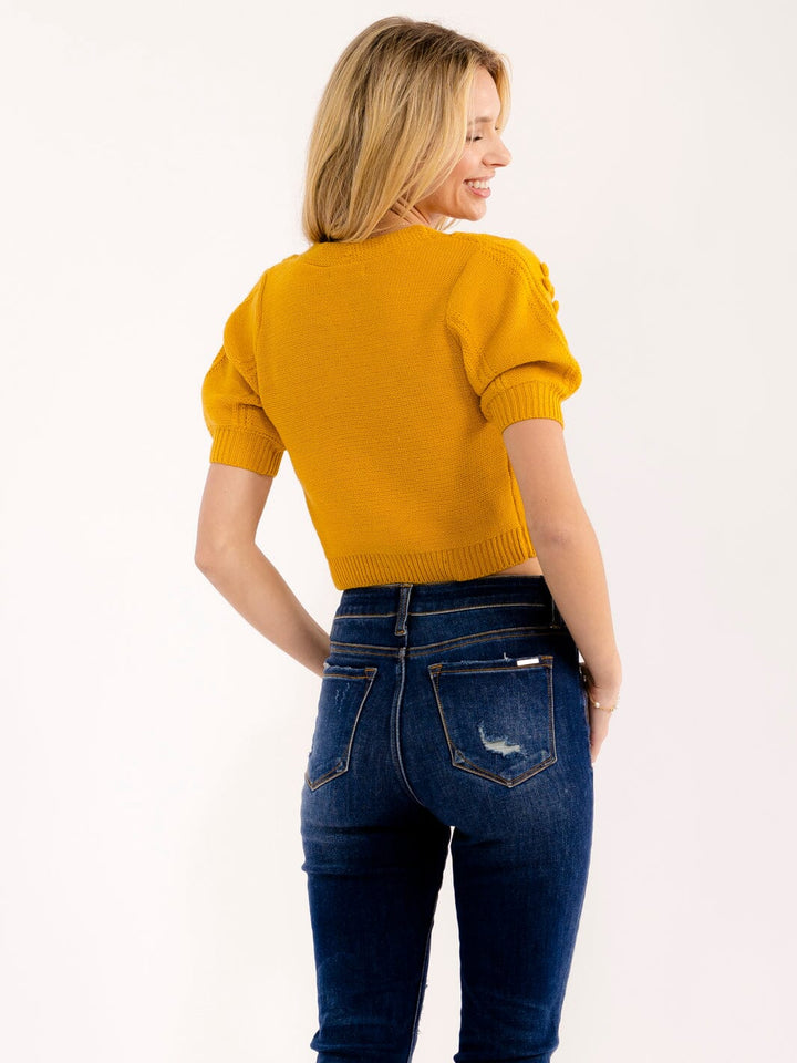 WOMEN'S SHORT SLEEVE BUTTON UP V-NECK POM POM DETAILED SWEATER TOP