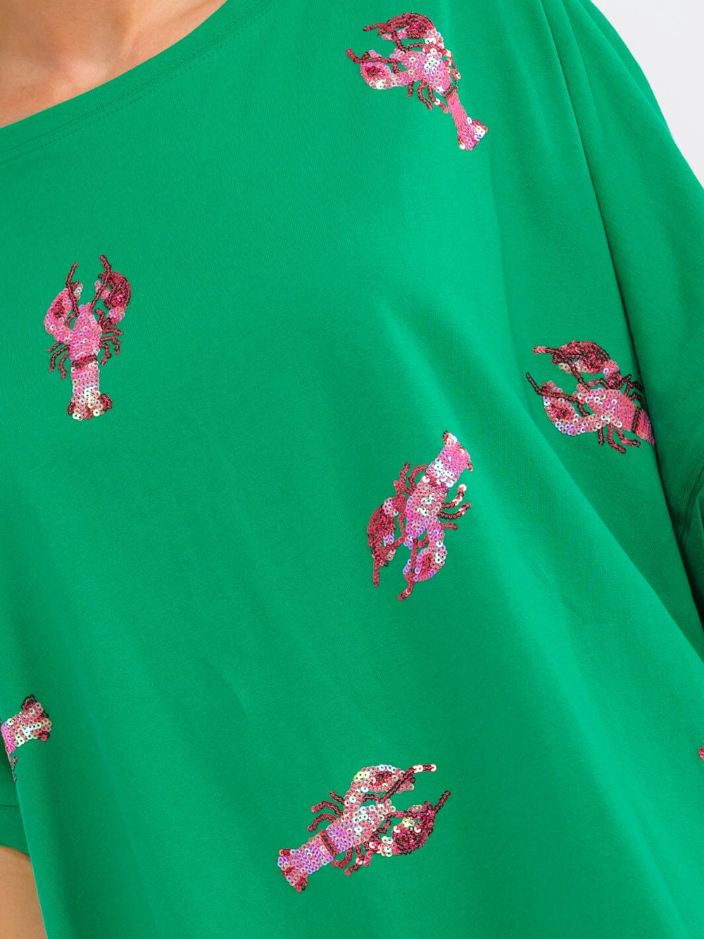 WOMEN'S SHORT SLEEVE SEQUINS GRAPGIC HIGH-LOW OVERSIZED SHIRT