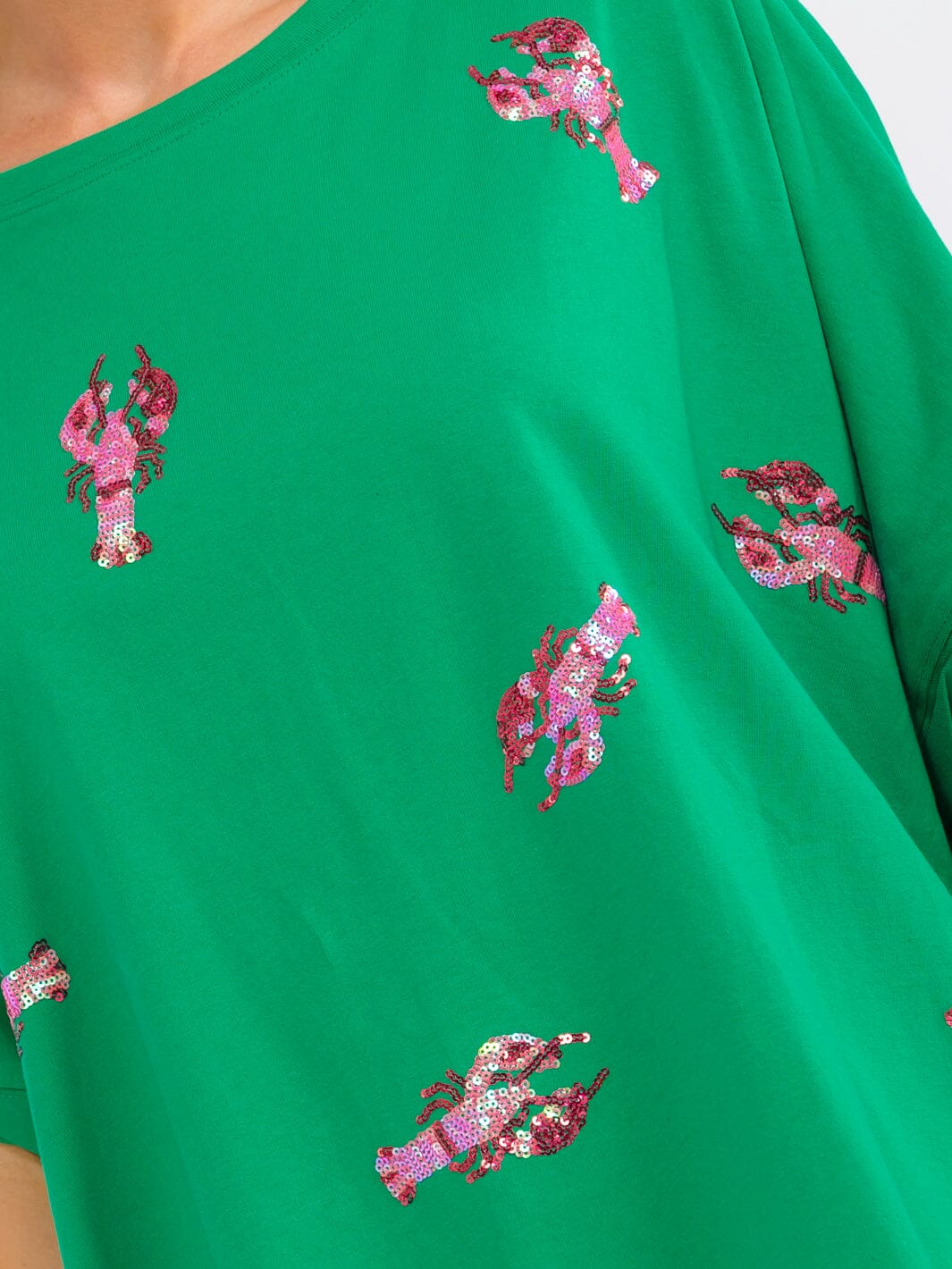 WOMEN'S SHORT SLEEVE SEQUINS GRAPGIC HIGH-LOW OVERSIZED SHIRT