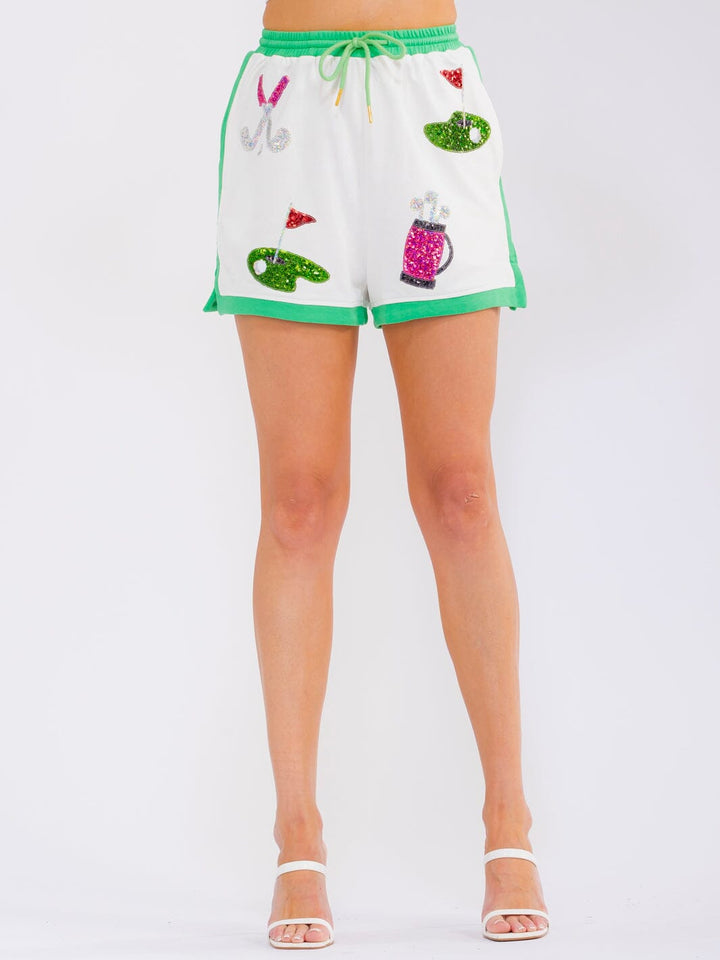 WOMEN'S ELASTIC WAIST SELF TIE FRONT POCKETS SEQUINS PRINT MINI SHORTS