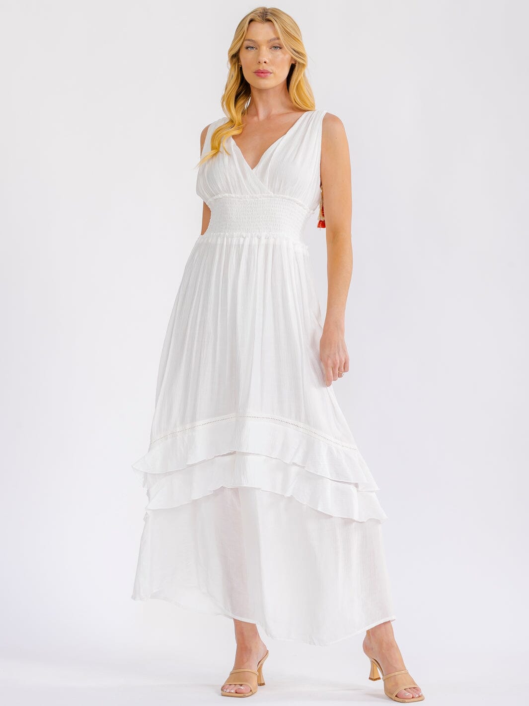 WOMEN'S SLEEVELESS V-NECK OPEN BACK SMOCK WAIST TIERED MAXI DRESS – Wholesalefashiontrends.com WOMEN'S SLEEVELESS V-NECK OPEN BACK SMOCK WAIST TIERED MAXI DRESS – Wholesalefashiontrends.com