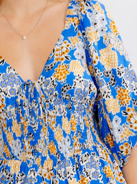 WOMEN'S SHORT SLEEVE V-NECK SMOCK WAIST TIERED FLORAL MINI DRESS