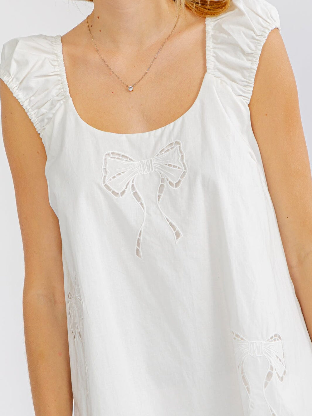 WOMEN'S SLEEVELESS EYELET BOWS TUNIC MINI DRESS