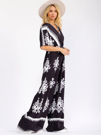 WOMEN'S SHORT SLEEVE SURPLICE ELASTIC WAIST WIDE LEG MULTI PRINT JUMPSUIT