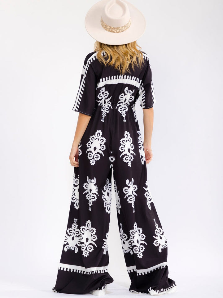 WOMEN'S SHORT SLEEVE SURPLICE ELASTIC WAIST WIDE LEG MULTI PRINT JUMPSUIT