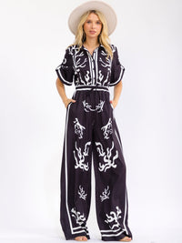 WOMEN'S SHORT SLEEVE BUTTON UP ELASTIC WAIST POCKETS WIDE LEG MULTI PRINT JUMPSUIT