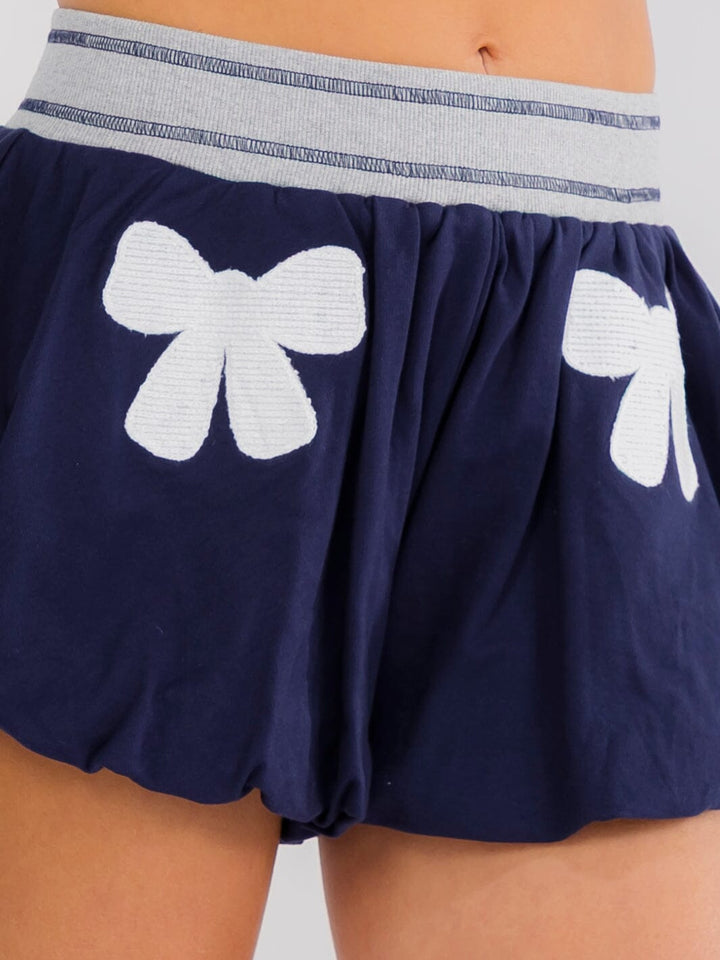 WOMEN'S ELASTIC WAIST BOWS PRINT BUBBLE HEM MINI SHORTS