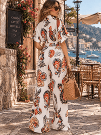 WOMEN'S SHORT SLEEVE BUTTON UP ELASTIC WAIST POCKETS WIDE LEG MULTI PRINT JUMPSUIT