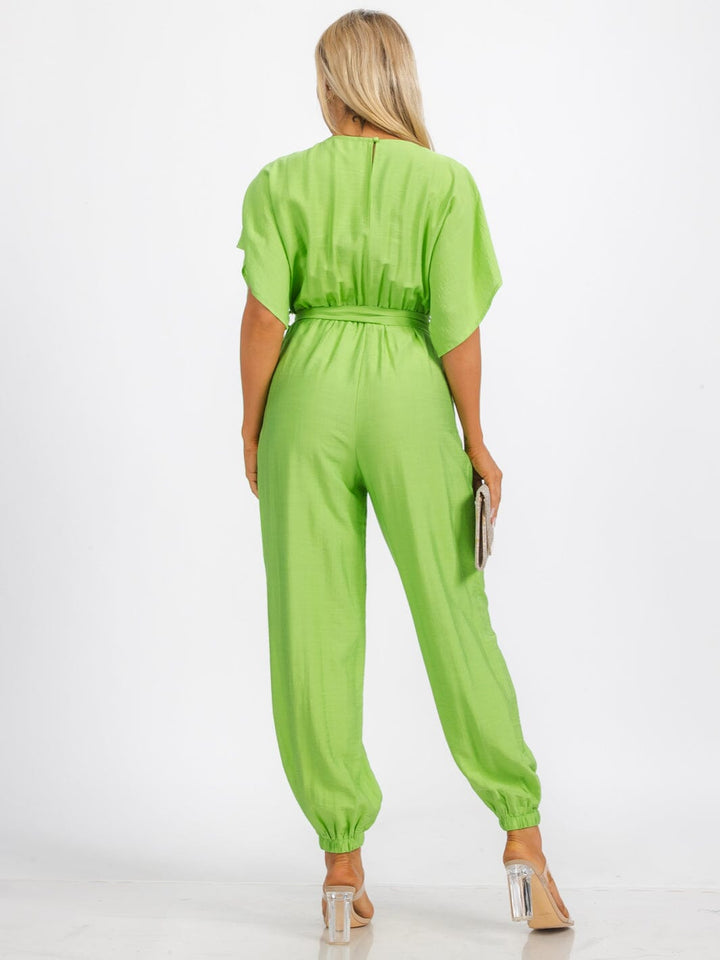 WOMEN'S SHORT SLEEVE SURPLICE FRINT POCKET SKINNY LEGS BELTED JUMPSUIT