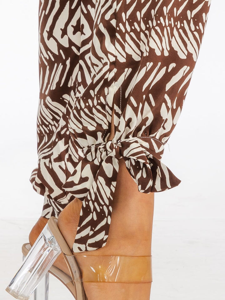 WOMEN'S LONG SLEEVE SURPLICE SELF TIE POCKETS PRINTED SKINNY LEG JUMPSUIT