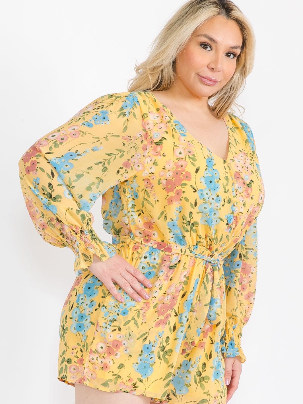 PLUS SIZE LONG SLEEVE BUTTON UP FRONT POCKETS SELF TIE FLORAL ROMPER