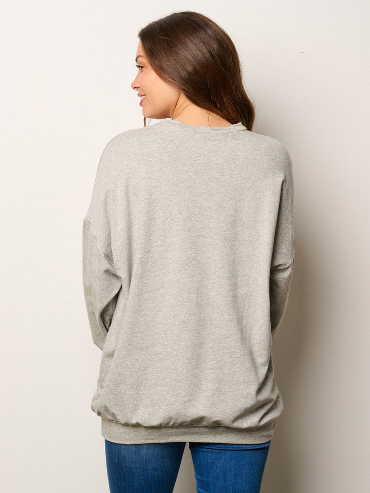 WOMEN'S LONG SLEEVE FRONT POCKETS GRAPHIC SWEATER