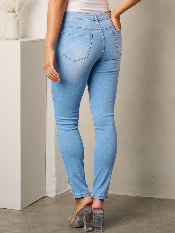 WOMEN'S BUTTON CLOSURE DISTRESSED SKINNY JEANS