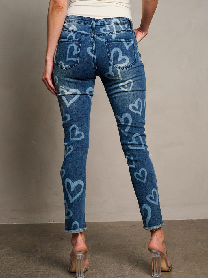 WOMEN'S BUTTON CLOSURE HEART PRINT DISTRESS DENIM SKINNY PANTS
