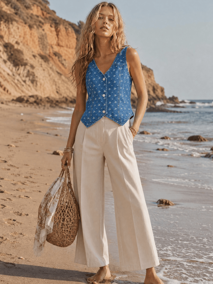WOMEN'S SLEEVELESS V-NECK BUTTON UP DISTRESS DENIM TOP