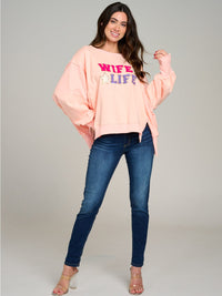 WOMEN'S LONG SLEEVE GRAPHIC HIGH-LOW OVERSIZED TOP