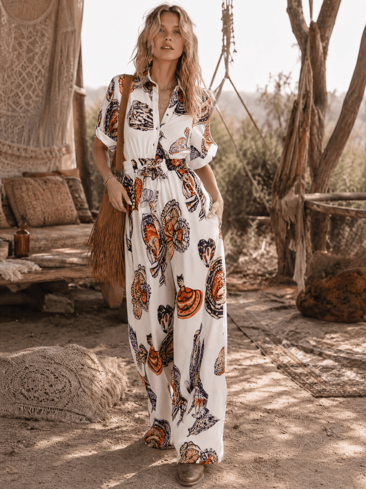 WOMEN'S SHORT SLEEVE BUTTON UP ELASTIC WAIST POCKETS WIDE LEG MULTI PRINT JUMPSUIT