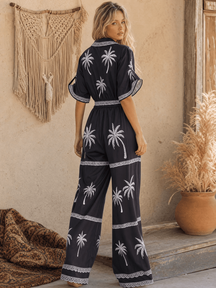 WOMEN'S SHORT SLEEVE BUTTON UP ELASTIC WAIST POCKETS WIDE LEG MULTI PRINT JUMPSUIT
