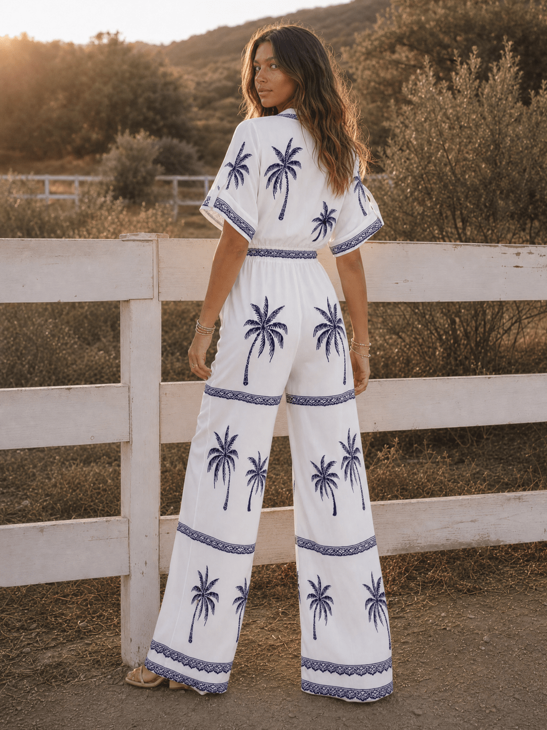 WOMEN'S SHORT SLEEVE BUTTON UP ELASTIC WAIST POCKETS WIDE LEG MULTI PRINT JUMPSUIT