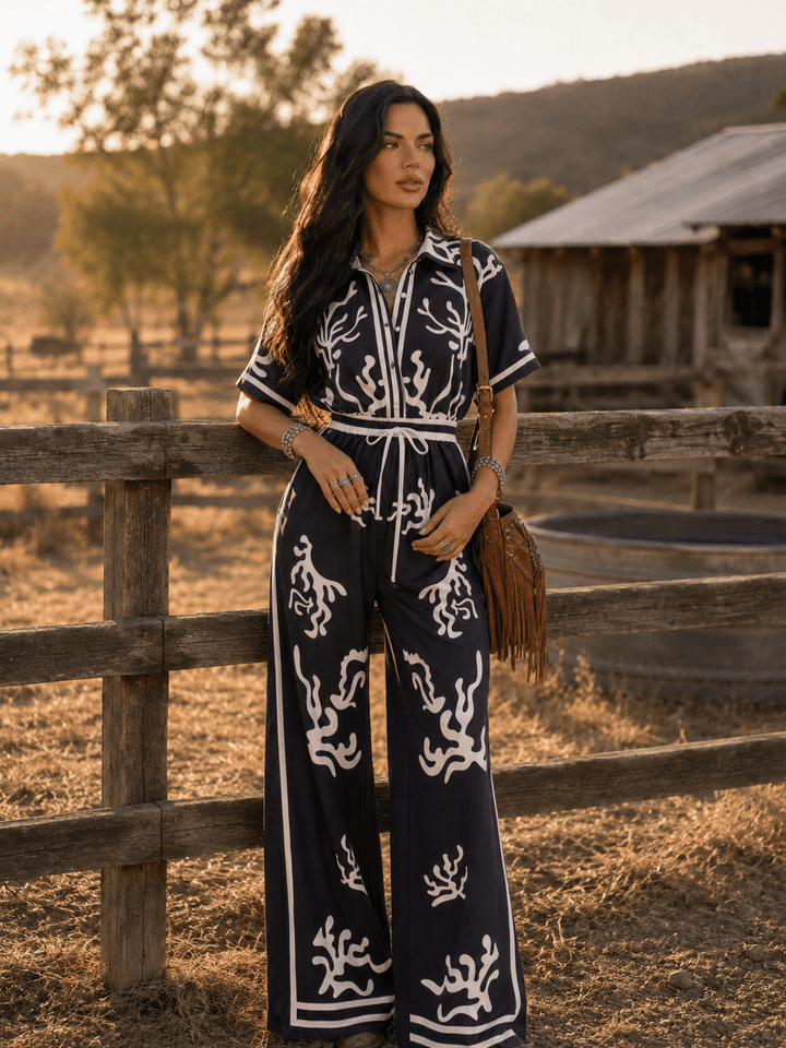 WOMEN'S SHORT SLEEVE BUTTON UP ELASTIC WAIST POCKETS WIDE LEG MULTI PRINT JUMPSUIT
