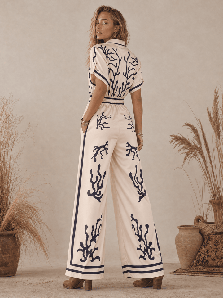 WOMEN'S SHORT SLEEVE BUTTON UP ELASTIC WAIST POCKETS WIDE LEG MULTI PRINT JUMPSUIT