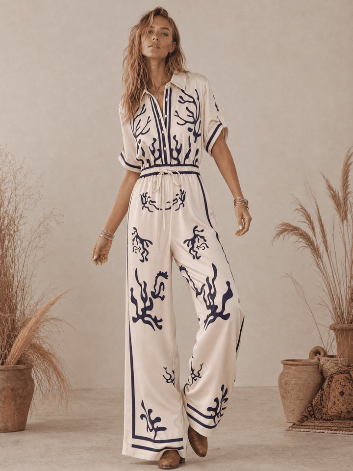 WOMEN'S SHORT SLEEVE BUTTON UP ELASTIC WAIST POCKETS WIDE LEG MULTI PRINT JUMPSUIT