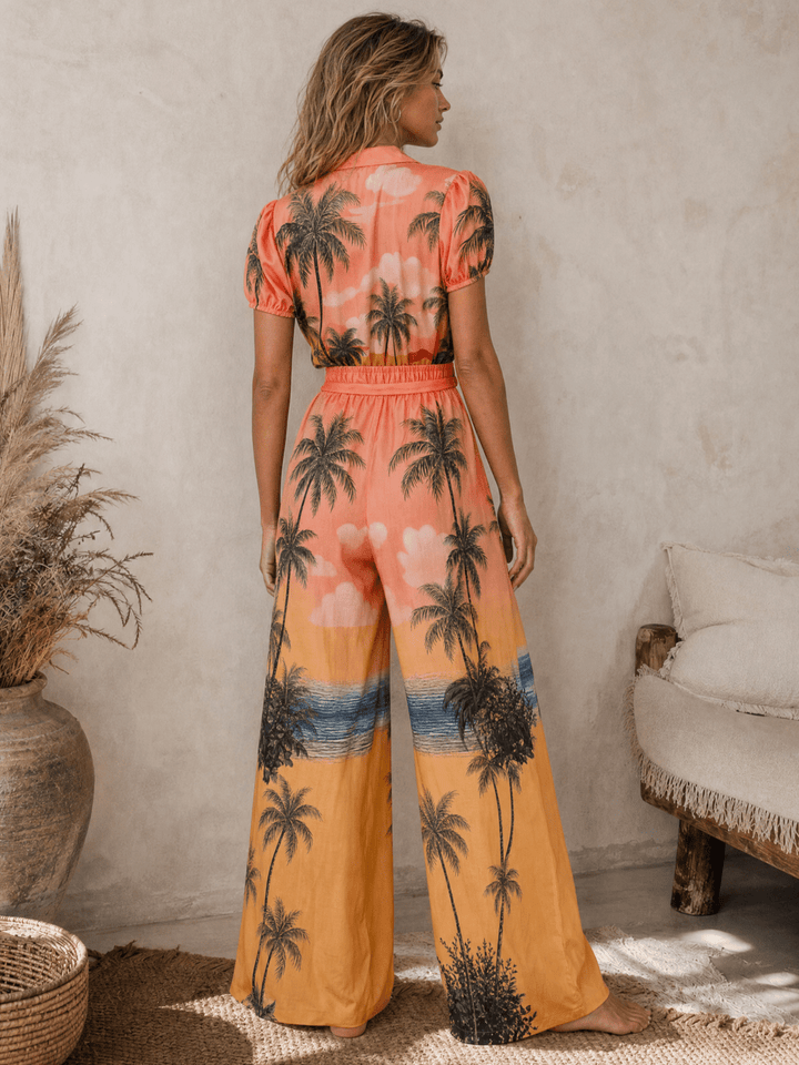 WOMEN'S SHORT SLEEVE BUTTON UP SELF TIE ELASTIC WAIST WIDE LEG MULTI PRINT JUMPSUIT