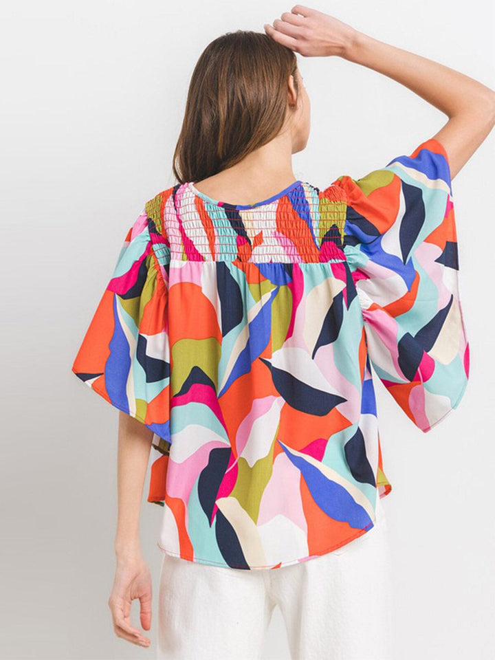 WOMEN'S SHORT RUFFLE SLEEVE MULTI PRINT BLOUSE