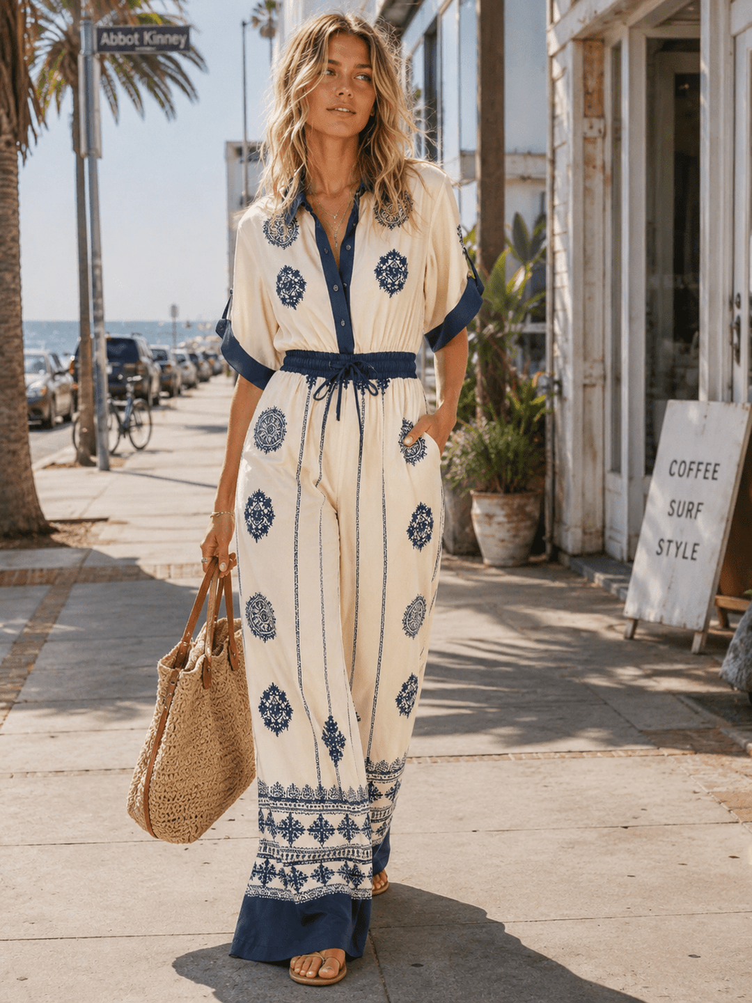 WOMEN'S SHORT SLEEVE ELASTIC WAIST FRONT POCKETS BUTTON UP WIDE LEG MULTI PRINT JUMPSUIT