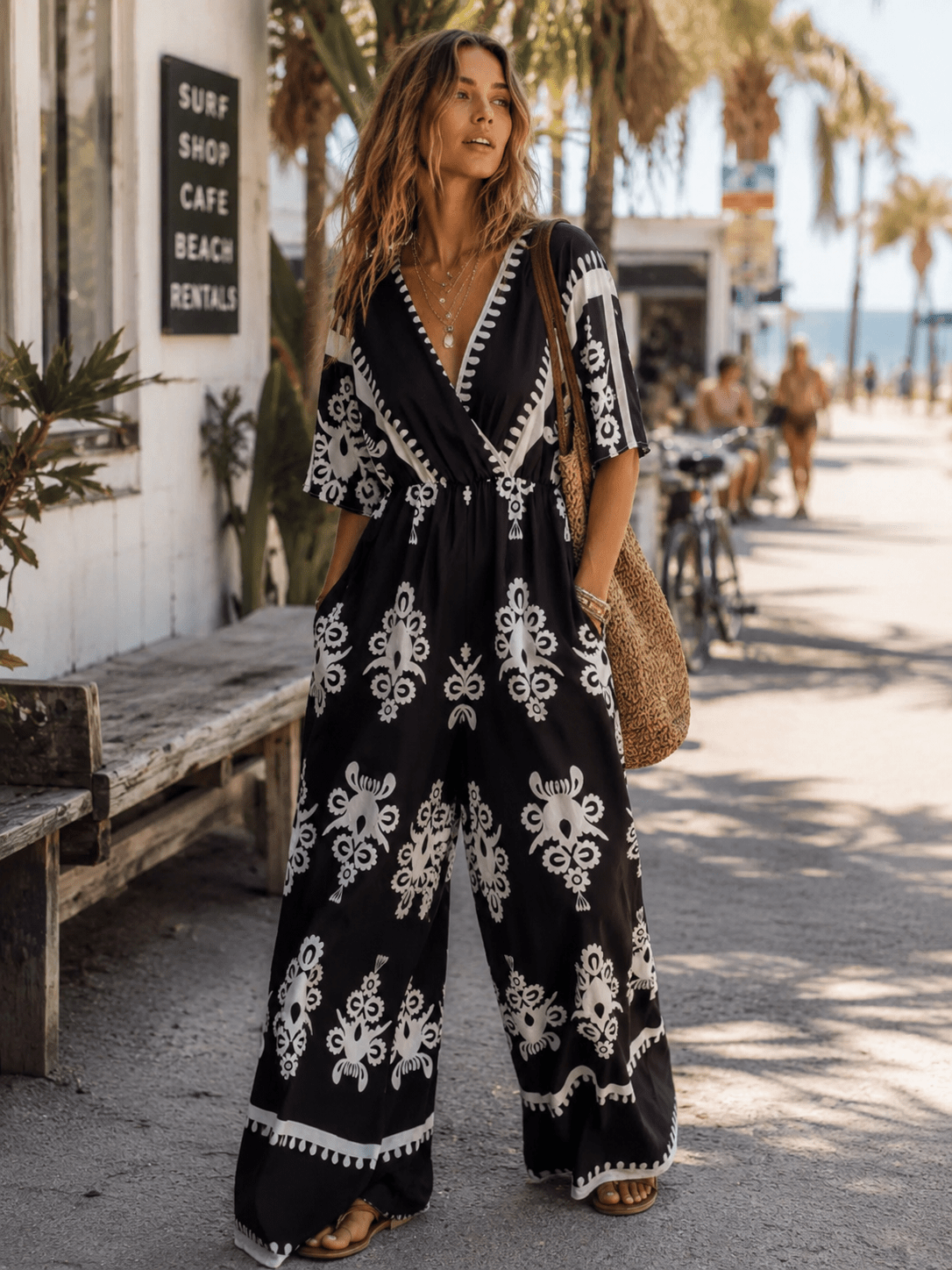 WOMEN'S SHORT SLEEVE SURPLICE ELASTIC WAIST WIDE LEG MULTI PRINT JUMPSUIT