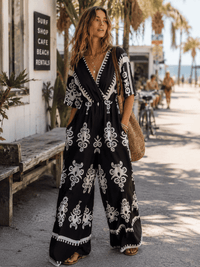 WOMEN'S SHORT SLEEVE SURPLICE ELASTIC WAIST WIDE LEG MULTI PRINT JUMPSUIT