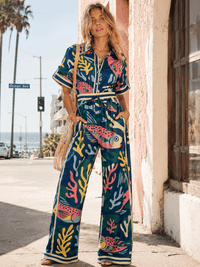 WOMEN'S SHORT SLEEVE BUTTON UP ELASTIC WAIST POCKETS WIDE LEG MULTI PRINT JUMPSUIT