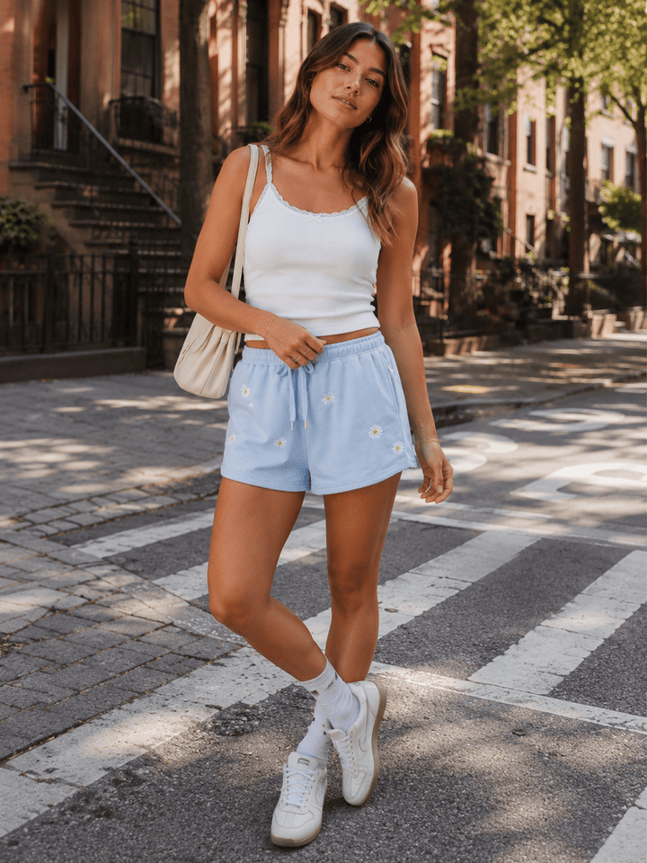 WOMEN'S ELASTIC WAIST SELF TIE FRONT POCKETS FLORAL MINI SHORTS