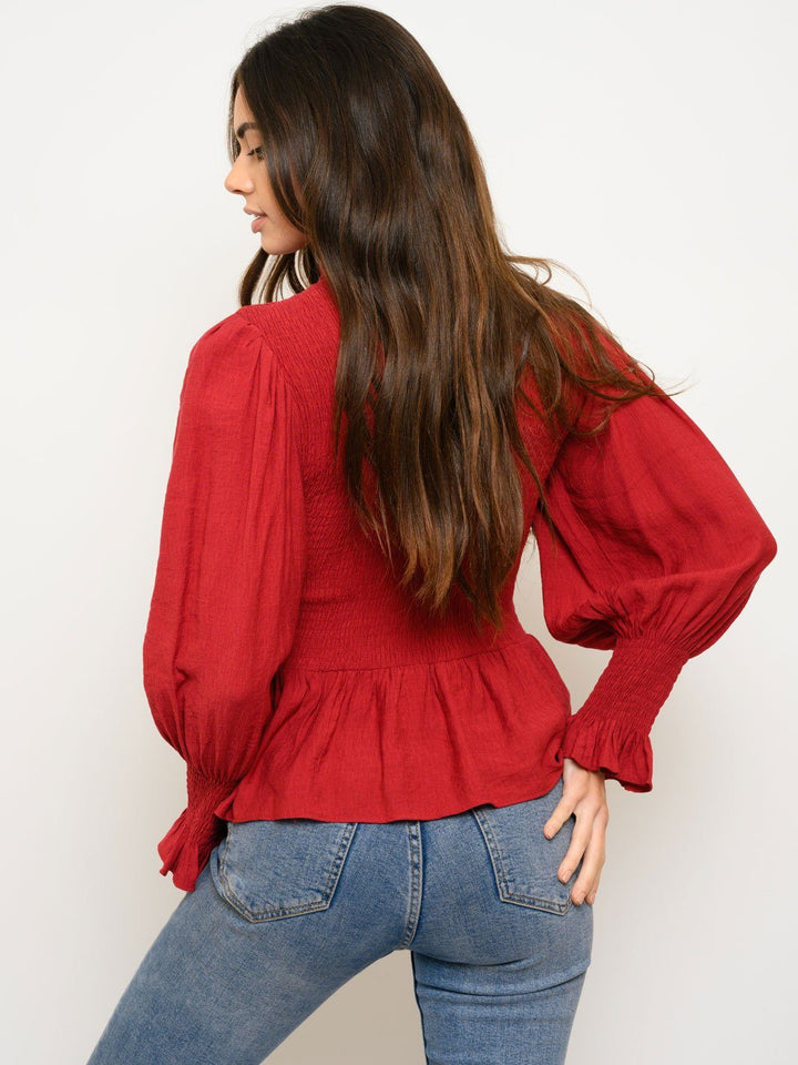 WOMEN'S WOVEN SOLID SMOCKED LONG SLEEVE PEPLUM TOP